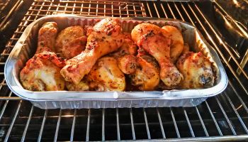 Homemade roasted chicken in oven whit spices.