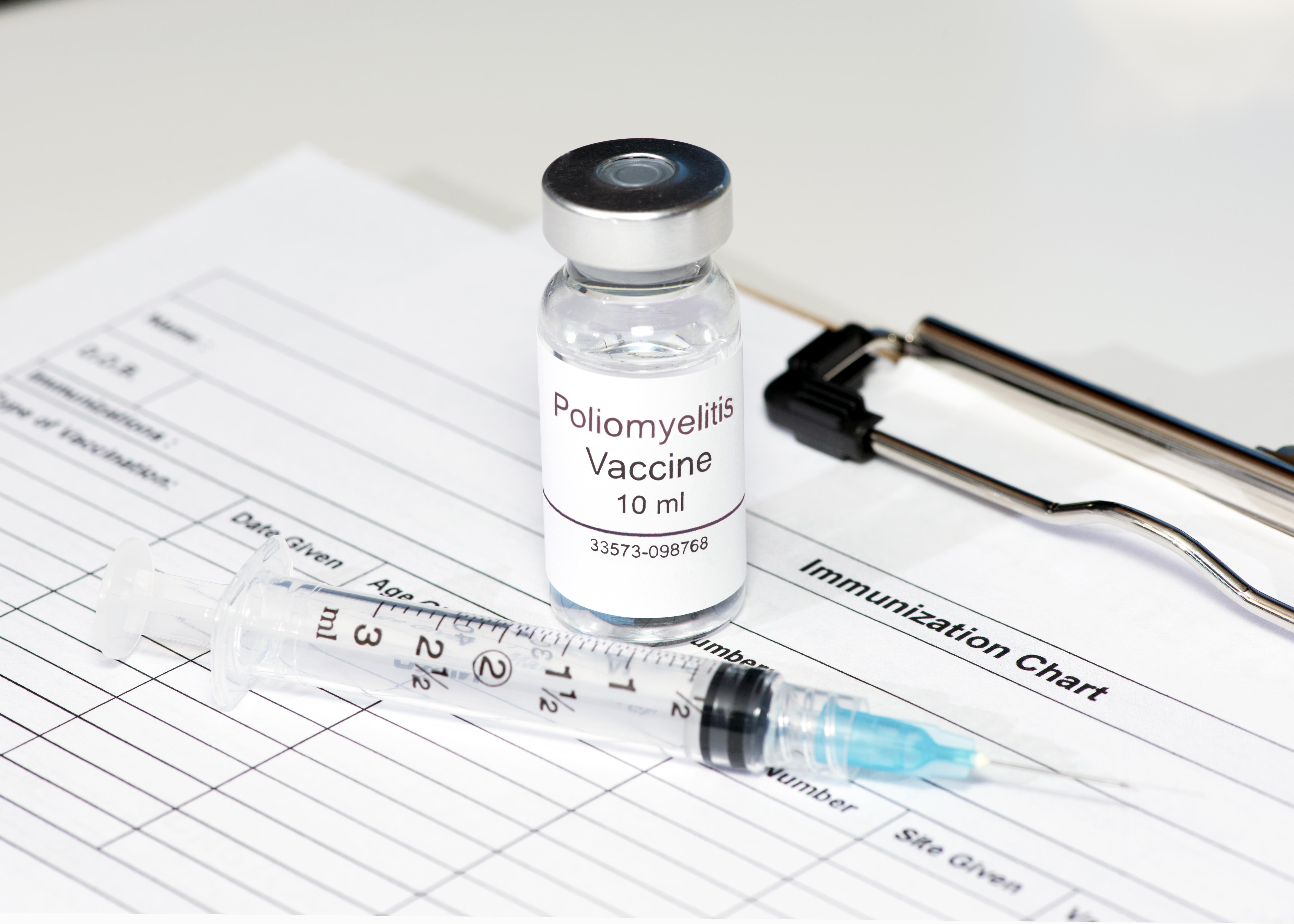Polio vaccine on patient immunization chart with syringe.