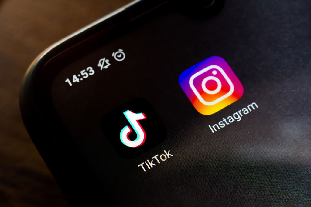 In this photo illustration a TikTok and an Instagram app...