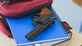 Backpack, notebooks, and handgun