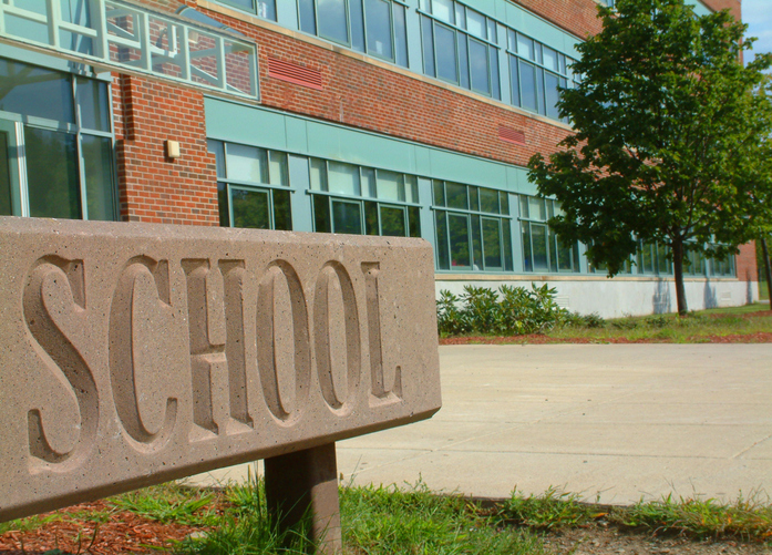 Large School sign in front of school building