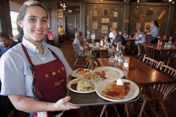 A waitress serving food at Cracker Barrel Old Country Store restaurant